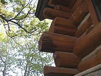 No log should project beyond the edge of the roof.